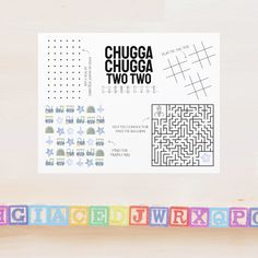 a wooden block with the word chuga chuga two on it next to colorful blocks