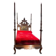 an old fashioned bed with red sheets and wooden posts on the headboard is shown against a white background