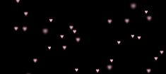 a black background with pink hearts on it