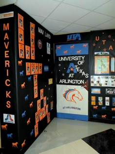 the university of texas at arlington exhibit is decorated with orange and black graphics