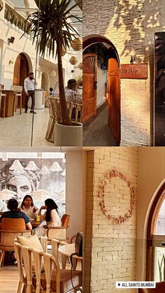 the inside of a restaurant with palm trees and people sitting at tables in front of it