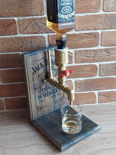 an old fashioned dispenser is turned into a drink dispenser