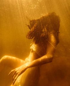 a woman is underwater in the water