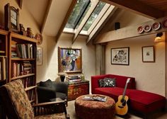 a living room filled with furniture and a skylight