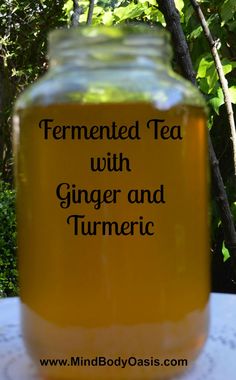 a jar filled with ginger and turment sitting on top of a white table