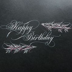 the words happy birthday written in chalk on a piece of black paper with white writing