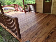 a wooden deck in front of a house