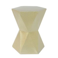 a white vase sitting on top of a table