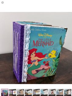 the little mermaid book is displayed on a table