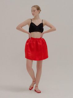 Editor's NotesThis red bell-shaped mini skirt features shirred waistline for a voluminous silhouette.- This item is part of the P for Performance line- High-rise waist creates a flattering elongating effect- Elastic waist band for a comfortable fit Measurements (inch)XS / S / M- Waist: 25.5 / 27 / 29- Hip: 57.3 / 58.8 / 60.8- Hem: 47.9 / 49.4 / 51.4- Length: 15.8 / 17.3 / 19.3* Model size: Height 5'6 / Bust 31.5 / Waist 22.8 / Hip 33.5 / Shoes US8                   Composition & Care- Outshell: 61% Linen, 39% Rayon- Dry clean onlyDesigner- Made in Korea- By EENK Red Flared Skirt For Night Out, Chic Red Skort For Party, Red Gathered Skirt For Party, Red Pleated Skort For Parties, Red Full Mini Skirt For Summer, Red Gathered Skirt Bottoms For Party, Red Flared Skort For Party, Red Full Mini Skirt For Spring, Red Mini Skirt For Evening