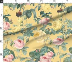 a yellow background with pink roses and green leaves on the bottom right corner is a ruler in front of it