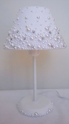 a lamp that has pearls on it