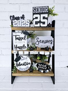 a shelf filled with wooden signs and plants