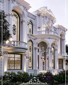 a large white house with many windows and balconies