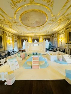 an elaborately decorated room with white and blue furniture