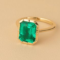 Make a captivating statement with our vivid green 4 ct Emerald Cut Peora Created Colombian Emerald Ring in 14K Gold. Handmade to order with exquisite attention to detail. Emerald Ring For Women, Wedding Emerald Open Ring With Bezel Setting, Emerald Ring Designs, Emerald Ring Design, Emerald Statement Ring, Non Diamond Engagement Rings, Emerald Engagement Ring Green, Colombian Emerald Ring, Chrome Green