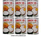 six cans of aroyd coconut cream