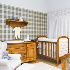 a baby's room with two cribs and a rocking chair