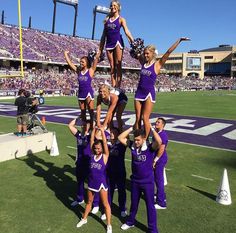 the cheerleaders are doing tricks on the field