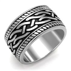 a silver ring with an intricate design on it