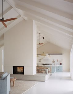 a living room filled with furniture and a fire place in the middle of a room