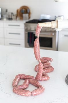 the sausages are being cooked on the kitchen counter