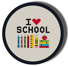 i love school cross - stitch pattern in white circle with black border and red heart