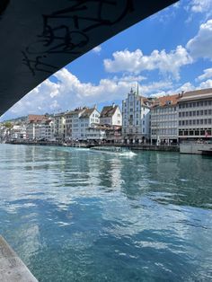 the water is clear and blue with buildings on both sides