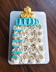 a cake with white frosting and blue icing