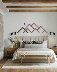 a bedroom with white walls and wooden beams on the ceiling, along with a large bed