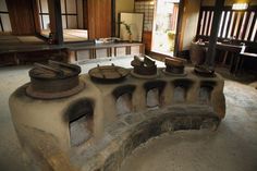 an old stone oven in the middle of a room