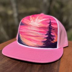 Looking for a way to stand out from the crowd? Check out Mary Bea Art's unique hand-painted hats! Each hat is a one-of-a-kind piece of wearable art, individually painted by Petoskey artist Mary Bea McWatters. With their bold colors and eye-catching designs, these hats are the perfect way to express your individual style and show off your love of nature and art. Whether you're looking for a way to add a pop of color to your outfit or just want a unique accessory that's sure to turn heads, Mary Bea Art's hand-painted hats are the perfect choice. Don't settle for ordinary - choose something truly special with a hand-painted hat! Artistic Hand Painted Adjustable Hats, Pink Trucker Hat With Curved Brim For Festivals, Artistic Hand Painted Flat Brim Hat, Artistic Adjustable Hats As Gift, Artistic Adjustable Baseball Cap, Pink Adjustable Fitted Hat With Curved Brim, Pink Adjustable Curved Brim Fitted Hat, Adjustable Pink Fitted Hat With Curved Brim, Artistic Hand Painted Cap