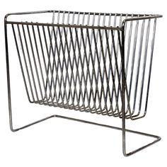 a metal wire magazine rack on a white background