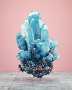 an image of some blue crystals in a vase on top of a wooden table with pink background