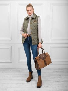 Breeze through spring in the Bella. This quilted cotton gilet is one you’ll live in all season thanks to its flattering fitted silhouette and smart styling. Button up and saddle up for a Sunday at the stables, or pull on with L’Alliance wellies for a weekend walk that ends at the pub. Product Details: Embroidered heritage logo: emblazoned with Fairfax & Favours heraldic logo Crafted from quilted cotton Branded antique brass buttons and shield rivet: unmistakably Fairfax & Favor Baby cord trims: Sage Quilt, Heraldic Logo, Business Travel Bag, Fairfax And Favor, Heritage Logo, The Stables, The Pub