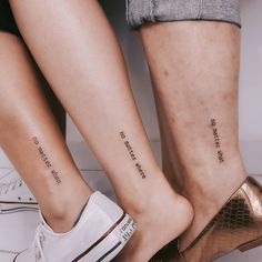 two people with matching tattoos on their legs, one has the word love and the other says