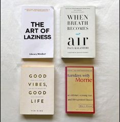 three books are laying on top of each other