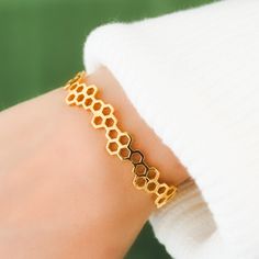 "Title: Hexagon Geometric Honey Comb Cuff Story:  Elevate your style with our striking hexagon geometric honeycomb cuff, intricately designed and brought to life through the art of 3D printing. The unique hexagon shape and honeycomb pattern lend a modern and contemporary flair to this adjustable cuff, ensuring a perfect fit for any wrist. Crafted with meticulous attention to detail, this cuff is a statement piece that seamlessly blends art and technology, adding a touch of sophistication to any Honeycomb Jewelry, Honey Bee Jewelry, Customised Bracelets, Jewelry Cute, Bee Jewelry, Honeycomb Pattern, Bangle Designs, Bracelet Cuff, Frozen 2