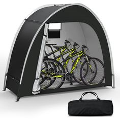 a tent with two bikes in it and a bag next to it