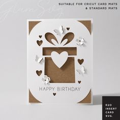 a birthday card with paper hearts and a gift box on it's side, in the shape of a heart