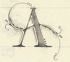 the letter a is drawn in pencil on paper