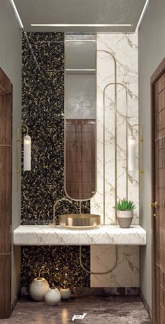 a bathroom with marble and gold accents