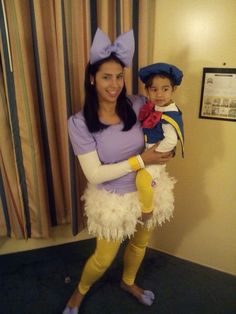 a woman and child dressed up in costumes