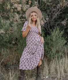 Fun floral midi dress with an elastic waistband, stretchy smocked bodice, v-neckline, tiered skirt and side pockets.

#modesty #modestclothing #modeststyle #modestwear #modestfashionblogger #modestootd 
#womenswear #dressesforwomen #dresses #modestboutique #modest

Self and Lining 100% Polyester

Hand wash in cold separately.

Aprox. measurements in inches:

S:Length-48 |Bust-28 |Waist-26

M:Length-48 |Bust-30 |Waist-28

L:Length-49 |Bust-33 |Waist-31

modest dresses, modest dress, modest midi, modest maxi, modest fashion, modest trendy dresses, modest boutique, modest attire, modest clothing, modest tops, modest skirts, modest shop