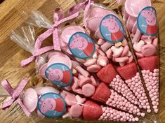 peppa pig lollipops and marshmallow candies on a table