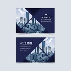 two blue business cards with cityscape in the background