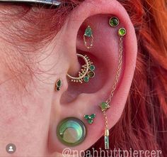 an ear with some piercings attached to it