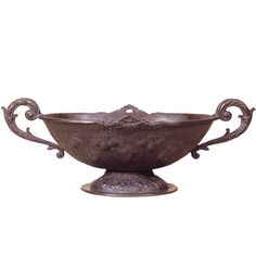 an ornate metal bowl on a white background