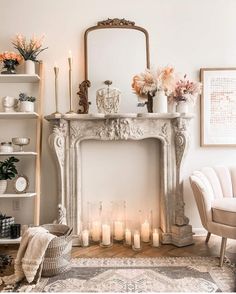 a living room with a fire place and lots of candles