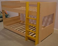 a wooden bunk bed with yellow ladders in a room